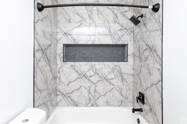 Redesigned bathrooms with chic tiles and custom shower niche - Autumn Columbia