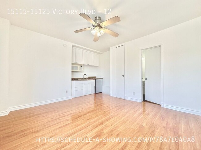 Building Photo - Updated top floor Studio apartment located...