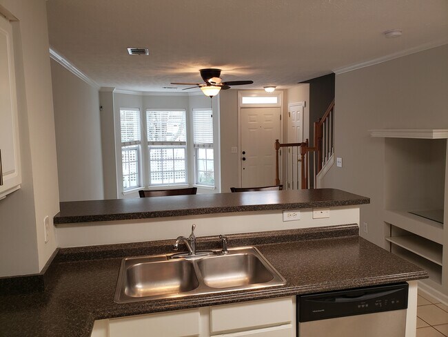 View toward front door from kitchen - 245 Wardington Pass