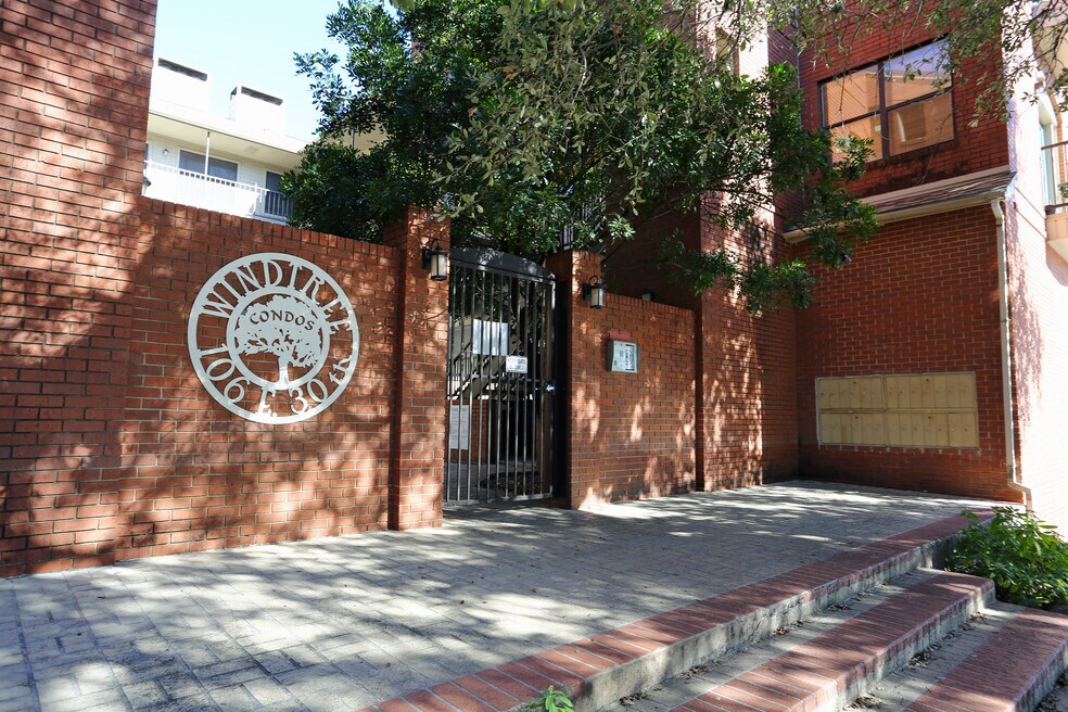 Gated Front Entry leads to open courtyard - 106 E 30th St