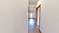 Located at 1200 Billy Frank Jr St in Bellingham, Washington, this four-bedroom, one-bathroom unit offers a practical and well-designed single-floor layout. Light wood-look flooring and warm orange baseboards run consistently throughout, creating a cohesive and clean aesthetic across every room.

The kitchen is a functional highlight, featuring light maple cabinetry, stainless steel appliances including a refrigerator, range, microwave, and dishwasher, along with a sink and ample counter space. A door from the kitchen area leads to a balcony, allowing natural light to flow into the space.

Each of the four bedrooms features the same light flooring and bright white walls, with windows that bring in natural light and offer views of the surrounding Bellingham neighborhood. Several bedrooms include built-in closets with wooden hanging rods, providing convenient storage solutions.

The bathroom is efficiently designed with a warm wood-toned vanity, white countertop, a full tub-shower combination, and recessed lighting, maintaining the clean, modern feel found throughout the unit.

Additional storage is available through a dedicated walk-in closet space with a built-in hanging rod. The overall ambiance is bright, clean, and move-in ready, making it well-suited for shared living in the heart of Bellingham, WA.