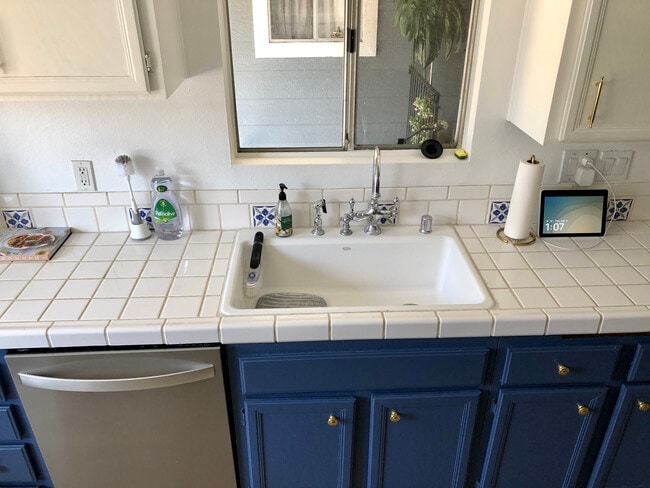 Sink is largest size cast iron from Koehler. Boasts Kingston Brass faucet. - 23705 Sea Breeze Ln