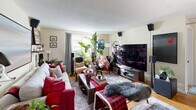 Located at 10-16 Vinal St in Boston's Brighton neighborhood, this 2-bedroom, 1-bathroom residence offers a thoughtfully arranged single-floor layout. The living room serves as the heart of the home, featuring warm hardwood floors, natural light from street-facing windows, and a welcoming atmosphere accented by lush indoor plants and curated wall art. A dedicated dining area adjacent to the living space provides a cozy spot for meals, with a window framing views of the surrounding neighborhood. The kitchen is efficiently designed with white cabinetry, black hardware, warm wood countertops, and a stainless steel sink, maximizing every inch of available space. The primary bedroom is comfortably proportioned, featuring a closet, hardwood flooring, a window for natural light, and direct access to the hallway. The second bedroom offers additional flexibility. The bathroom showcases classic subway tile in a soft blue-grey tone, accented with black trim detailing, adding a stylish, timeless character. With four closets and a utility room, storage is well-addressed throughout. The home's warm, neutral palette and hardwood floors create a cohesive and inviting ambiance across all rooms.