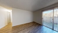Located at 39655 Trinity Way in Fremont, CA, this single-floor unit offers a practical and well-organized layout with a variety of comfortable living spaces. The main living area is bright and open, showcasing durable wood-look flooring, neutral-toned walls, and a textured ceiling. A sliding glass door allows natural light to pour in while providing access to the outdoors. A ceiling fan adds both function and airflow to the space.

The kitchen is adjacent to the living area and features white cabinetry, white appliances including a range, a sink with ample counter space, and clean, light-toned flooring—creating a crisp, functional workspace.

The bedrooms are carpeted for comfort and offer generous proportions. Each room benefits from natural light through windows with blinds that frame outdoor views of surrounding greenery. Baseboard heating units are present throughout the bedrooms, ensuring year-round comfort. One bedroom includes multiple closets, offering practical storage solutions.

The bathroom is finished cleanly with a white vanity, light stone-look countertop, a large mirror, and wood-look flooring. The overall aesthetic throughout the unit is clean, neutral, and move-in ready, making it a functional and comfortable residence in the heart of Fremont.