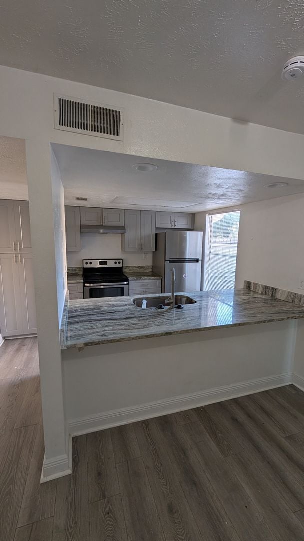 Building Photo - Two Bedrooms with terrace and fenced patio. Move in Special: Move before January 1sth for a secur...