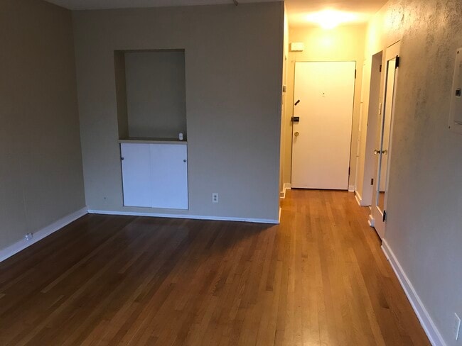 Built-in shelves in living area - 221 Belmont Ave E