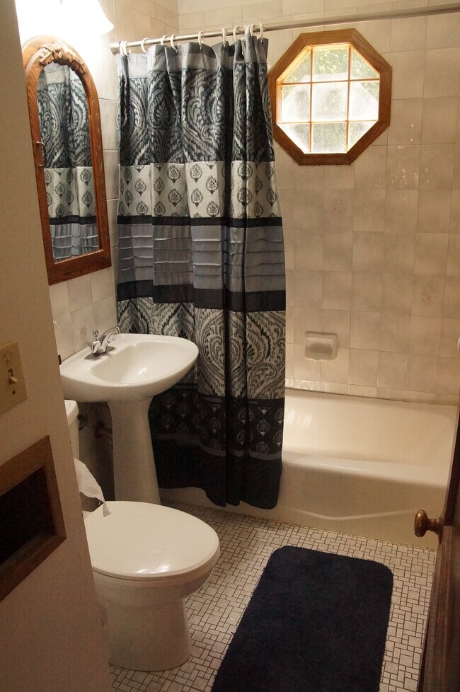Updated restroom with historic charm. - 234 Clermont St