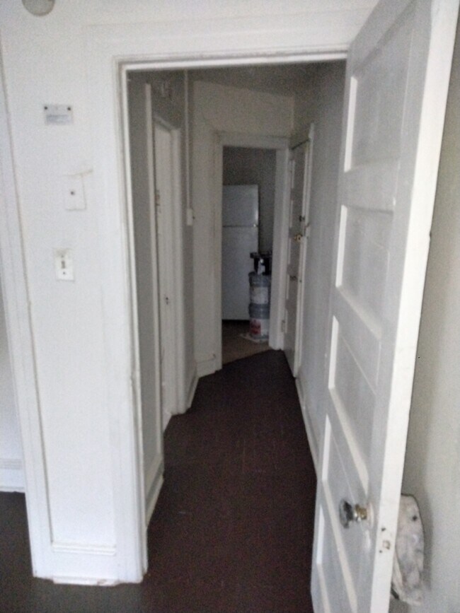 Hallway from living area to bathroom and kitchen - 21 Chester Pike