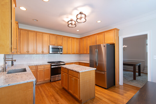 Large updated kitchen with island - 1029 Longley Ave NW