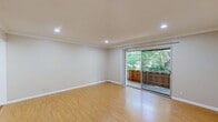 Located at 1735 Woodland Avenue in Palo Alto, CA, this well-appointed 1-bedroom, 2-bathroom unit offers a thoughtfully organized layout with a welcoming entrance that flows naturally into the main living areas. The living room is a bright, open space highlighted by warm hardwood flooring, crown molding, and recessed lighting throughout. Sliding glass doors lead directly to a private balcony overlooking lush greenery, filling the room with natural light and a serene outdoor connection. The kitchen features white cabinetry, tile countertops, a stainless steel sink, and tile flooring, with appliances including a white refrigerator and range. The bedroom is a comfortable retreat with mirrored sliding closet doors that enhance the sense of space, hardwood floors, crown molding, and a window offering natural light. Three closets across the unit provide ample storage. Both bathrooms are functional and clean, with one featuring a granite-topped vanity, medicine cabinets, tile flooring, and a tub-shower combination. The unit includes a wall heating unit and intercom system. The overall ambiance is clean, neutral, and move-in ready, well-suited for those seeking a practical yet comfortable home in a prime Palo Alto location.