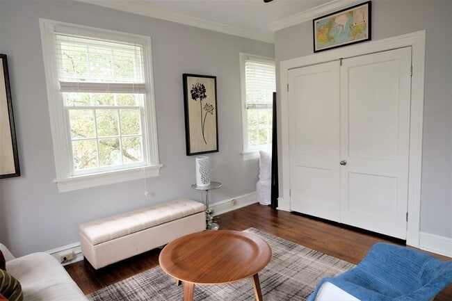 Living room, murphy bed behind doors. - 3300 Saint Charles Ave