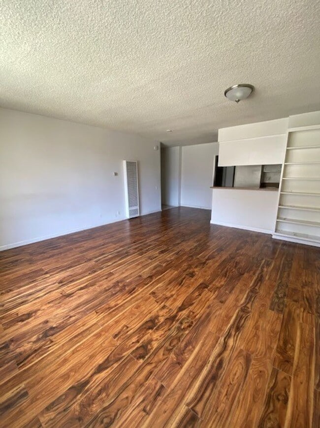 Interior Photo - Remodeled apartments *Hardwood Floors* *Intercom* *Garage parking*
