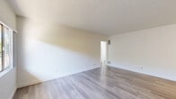 Located at 326-334 W Chevy Chase Dr in Glendale, CA, this 2-bedroom, 2-bathroom residence offers a clean, modern aesthetic across a well-organized single-floor layout. Light wood-style flooring runs throughout the unit, complementing the crisp white walls and textured ceilings to create a bright, cohesive atmosphere.

The living room is a comfortable, open space featuring a wall-mounted air conditioning unit and a large window that invites natural light and provides views of the surrounding neighborhood. A front entry door opens directly into this area, lending a welcoming feel.

The galley-style kitchen is efficiently designed with white shaker cabinetry, stone-look countertops, a gas range, and ample storage on both sides. A window at the end of the kitchen allows natural light to fill the space.

The primary bedroom is generously sized, featuring a ceiling fan with light fixture and a wide window showcasing scenic views of the Glendale cityscape and surrounding hills. The second bedroom is equally bright, with its own window offering open outdoor views.

Both bathrooms feature wood-style flooring, white vanities with stone-look countertops, and clean, simple finishes. One bathroom includes a full tub-shower combination with a window above for natural light. A connecting hallway ties all rooms together in a practical and functional flow.