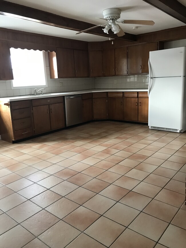 Spacious Kitchen to include dishwasher, fridge and stove/oven. - 8560 Main St