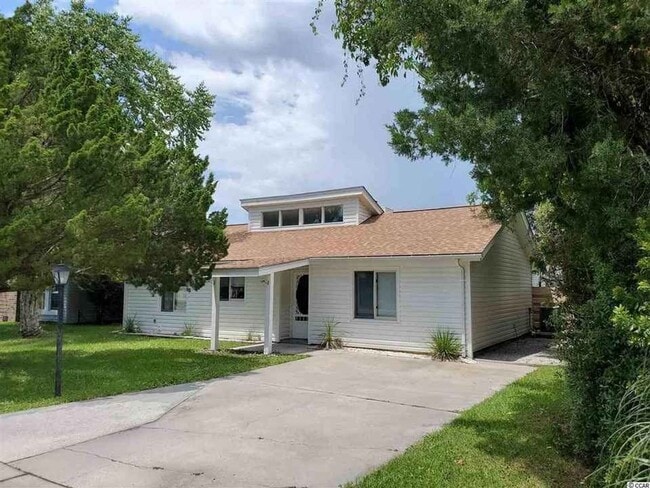 Building Photo - PET-FRIENDLY, THREE-BEDROOM IN SURFSIDE BEACH'S CAROPINES COMMUNITY IS AVAILABLE NOW!