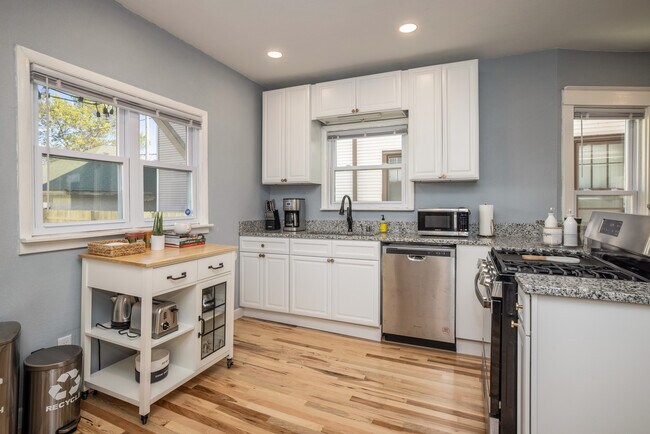 Kitchen - fully stocked with appliances and cooking utensils - 2408 E Belleview Pl