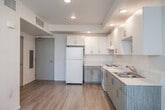 Located at 4320 44th Street in San Diego, CA, this single-floor, one-bedroom, one-bathroom unit offers a clean, modern aesthetic with a highly functional layout. The open-concept main area seamlessly combines the living, dining, and kitchen spaces into one cohesive room, making efficient use of the available footprint. Light wood-tone flooring runs throughout, lending warmth and continuity to the interior.

The kitchen is well-appointed with white upper cabinetry featuring sleek bar-pull hardware, complemented by two-tone textured lower cabinets in a soft gray-wood finish. A white electric range, a full-size refrigerator, and a double-basin sink with light countertops complete the functional cooking space. Recessed lighting illuminates the kitchen and living area, enhancing the bright, airy atmosphere.

The bedroom is a quiet, simply finished room with light wood flooring and a large window dressed with vertical blinds, allowing natural light and outdoor views of the surrounding neighborhood. Two closets provide practical storage solutions within the unit.

The bathroom features a clean, minimal design consistent with the rest of the home. Throughout the space, white walls, recessed lighting, and light flooring create a cohesive, contemporary feel that is both inviting and easy to personalize.