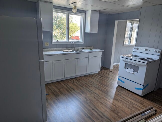 Kitchen with updated cabinets, counter tops and new appliances - 302 Jerome Ave