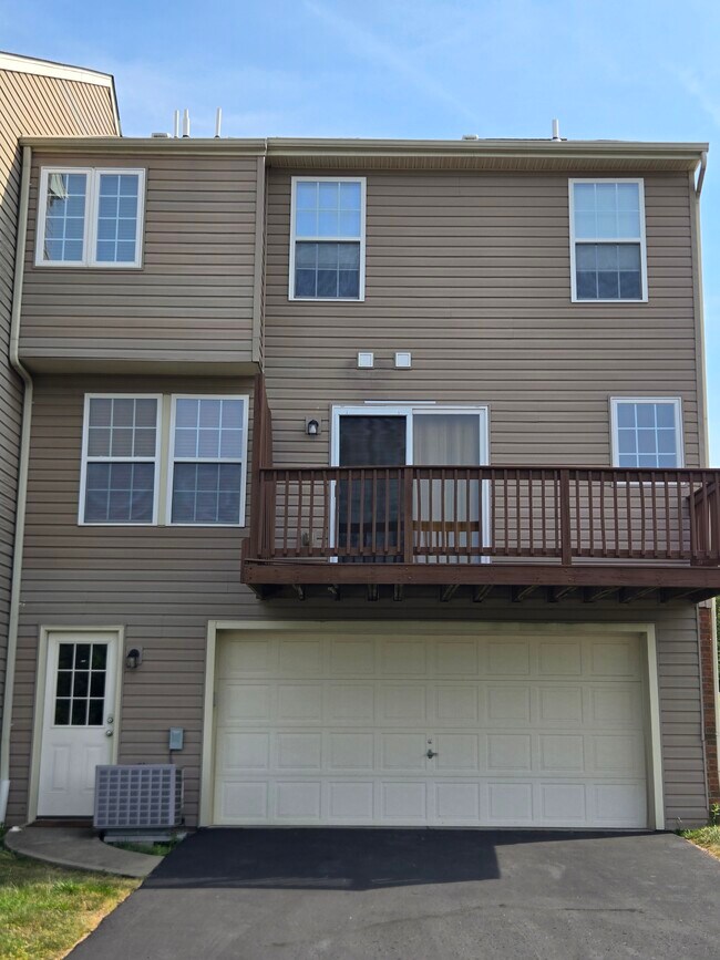 Rear of townhouse showing 2 car garage - 1812 Michael Dr
