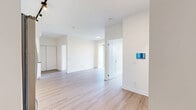 Located at 2215 Sheridan Park Drive in Mississauga, this well-appointed 2-bedroom, 1-bathroom unit offers a thoughtfully designed layout with modern finishes throughout. Light-toned laminate flooring runs seamlessly across the space, complementing the bright, neutral palette that creates a clean and contemporary atmosphere.

The kitchen is a standout feature, equipped with full-height white gloss cabinetry, dark quartz countertops, a metallic tile backsplash, and a complete suite of stainless steel appliances including a refrigerator, dishwasher, over-the-range microwave, and electric range. Track lighting overhead adds a polished finishing touch.

Both bedrooms are bright and airy, each featuring large sliding glass doors that connect to a balcony and allow abundant natural light to fill the rooms. The primary bedroom includes a built-in sliding-door closet for convenient storage. The balcony offers expansive, elevated views of lush green parklands and the Mississauga skyline under open skies — a true highlight of the unit.

The bathroom is finished with crisp white subway-style wall tiles, a soaker tub with a handheld shower fixture, and clean chrome hardware, maintaining the modern and minimalist aesthetic found throughout the space.