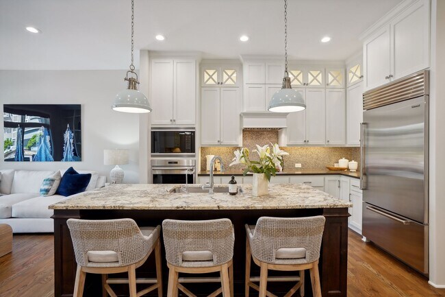 Bright kitchen with custom cabinetry. - 935 Lake St E