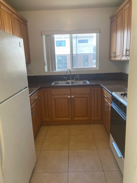 Kitchen with dishwasher and refrigerator - 5462 Barton Ave