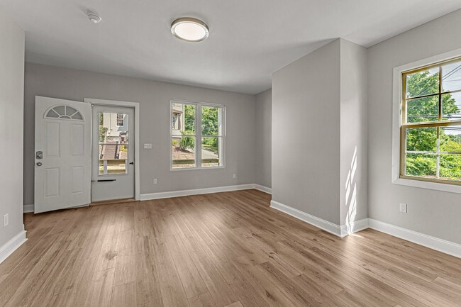 First floor living room featuring new hardwood floors! - 101 W 10th Ave