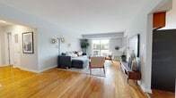 Located at 2674 Wildberry Ct in Edison, NJ, this well-designed 2-bedroom, 2-bathroom single-floor home offers a functional and comfortable layout throughout. Warm hardwood flooring flows consistently across the main living areas, creating a cohesive and inviting atmosphere.

The open living room is bright and airy, featuring large sliding glass doors that lead to a private balcony with outdoor views, filling the space with abundant natural light. The dining area is highlighted by a stylish statement pendant light fixture and a window with garden views, adding character to everyday meals. Adjacent to the dining area, the kitchen is outfitted with rich wood cabinetry, granite countertops, and stainless steel appliances, offering ample storage and prep space.

The generously sized primary bedroom features hardwood floors, a large window, and a spacious walk-in closet with built-in shelving and hanging rods. The second bedroom is versatile and comfortable, also finished with hardwood flooring and good natural light. Both bathrooms are functional and well-finished, with the full bath featuring tile flooring, a wood vanity, mirrored medicine cabinet, and a glass-enclosed shower. A hallway and entrance area complete the thoughtful floor plan, making this home practical and move-in ready.
