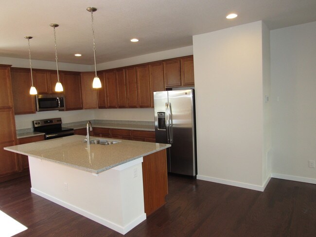 Kitchen with large island - 15801 East Broncos Place