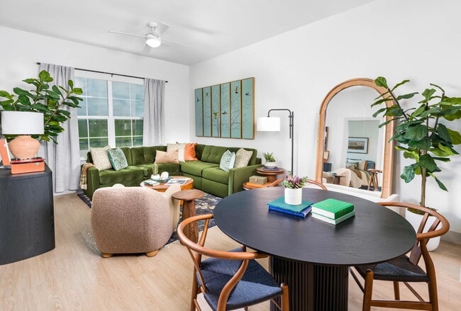 Thoughtfully designed living areas feature wood-style flooring and smart tech for effortless living. - Modera McKinney Ridge