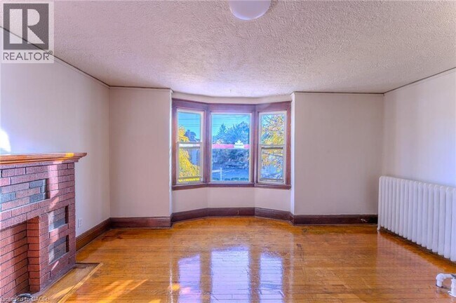 Building Photo - 1369 Main St E