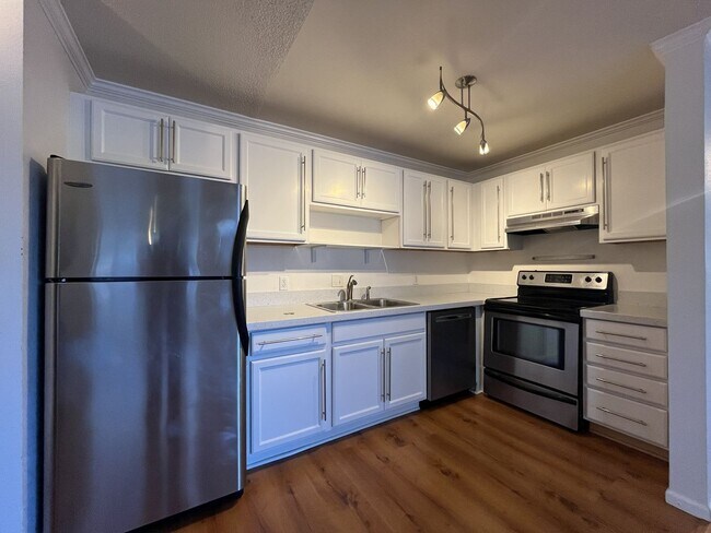 Building Photo - NE  ~ Charming  2 Bedroom 1 Bathroom Condo! Reserved Parking, Storage , Some Utilities Included! ...