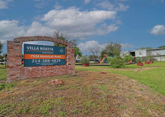Community Entrance – Well-kept landscaping and welcoming curb appeal. - Villa Rosita
