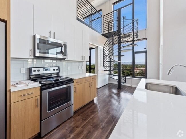 2 Bedroom w/ Loft with two-tone walnut cabinetry and pearl countertops. - 24Fifty at University Park - Historical Ac...