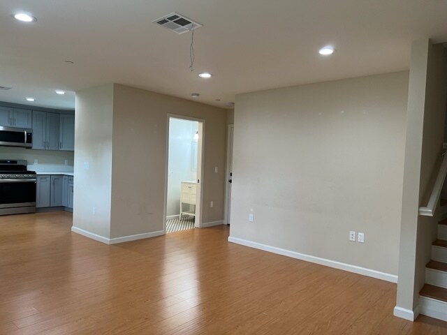 Open Concept_Kitchen_LR_Powder Room_Garage Access - 596 N Mar Vista Ave