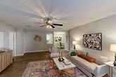Located at 248 Debuys Rd in Biloxi, Mississippi, this well-appointed 2-bedroom, 2-bathroom single-story home offers a thoughtfully designed layout with a welcoming ambiance throughout. The open-concept living and dining area serves as the heart of the home, featuring durable hardwood-style flooring, a ceiling fan with light fixture, and a cozy fireplace flanked by a patio door that fills the space with natural light. The living room flows seamlessly into a dedicated dining nook, illuminated by a stylish chandelier. The galley-style kitchen is outfitted with white cabinetry, speckled stone countertops, stainless steel appliances including a gas range and refrigerator, and a skylight, with direct access to an in-unit laundry room. The primary bedroom offers plush carpeting, a ceiling fan, generous closet space, and an en-suite bathroom featuring a wide vanity with stone countertops. The second bedroom also includes carpeting, a ceiling fan, and its own patio door access. A second full bathroom mirrors the same clean, neutral finishes. With seven closets, a pantry, and two outdoor patios, this home delivers exceptional storage and indoor-outdoor connectivity in a single-level, easy-to-navigate floor plan.