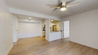 Located at 17239 N 19th Ave in Phoenix, AZ, this well-appointed 2-bedroom, 2-bathroom single-story home features a clean, modern aesthetic throughout. Light wood-style flooring flows continuously across the entire space, creating a cohesive and bright atmosphere. The open-concept living area combines the living room, dining room, and kitchen into one functional zone, enhanced by ceiling fans with integrated lighting. A sliding glass door in the living room fills the space with natural light and provides outdoor access.

The kitchen is a standout feature, offering granite countertops, a peninsula with an undermount stainless steel sink, white cabinetry, stainless steel appliances including a refrigerator, range, microwave, and dishwasher, and a tiled backsplash. Ample cabinet storage lines both sides of the galley-style kitchen layout.

Both bedrooms are comfortably sized, featuring ceiling fans, light flooring, and closet access. The primary bedroom includes its own private bathroom. The second bathroom features a tub-shower combination with brushed nickel fixtures and wall-mounted cabinetry for storage. Both bathrooms include granite-topped vanities and wood-look flooring. A dedicated laundry area and four closets throughout the home add practical storage solutions.