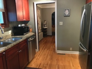 Kitchen with granite, new refrigerator - 5257 Columbus Ave