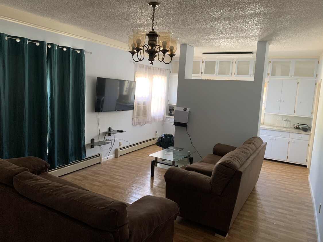 Living room, furniture and tv can stay with full security deposit. - 2341 S Illinois Ave