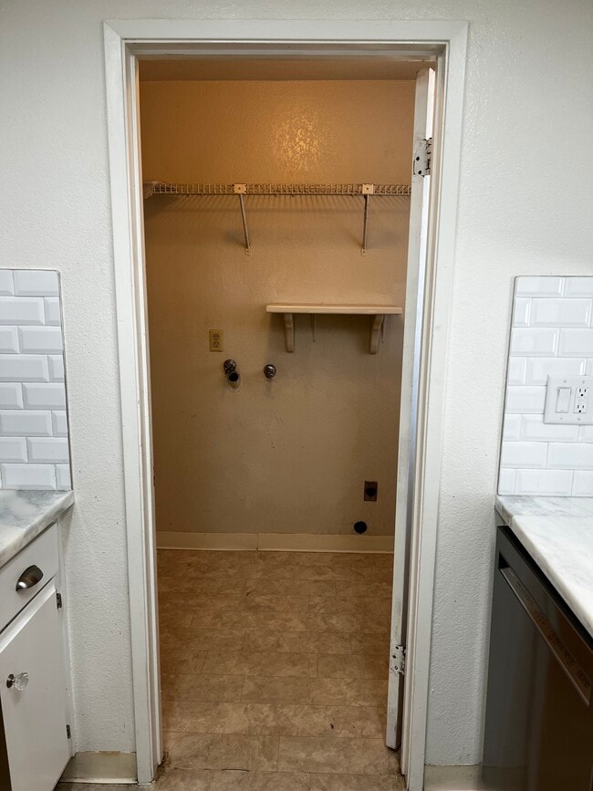 Inside laundry hookups next to kitchen - 9012 Cornwall Dr