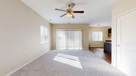 This well-appointed one-bedroom, one-bathroom home in Wichita, Kansas offers a thoughtfully designed single-floor layout that maximizes comfort and functionality. The living room is bright and inviting, featuring plush carpeting, a ceiling fan with light fixture, and a sliding glass door with vertical blinds that opens to an outdoor patio, allowing natural light to pour in throughout the day. Multiple windows fitted with horizontal blinds further enhance the airy feel of the space.

The kitchen is a standout feature, showcasing rich dark cabinetry, granite countertops, a tile backsplash, and stainless steel appliances including a full-size refrigerator, range, and microwave. Warm wood-look flooring runs throughout the kitchen and extends to the adjoining dining area, which includes a built-in desk nook. Pendant lighting above the kitchen island adds a modern touch.

The bedroom is generously sized with soft carpeting, a ceiling fan, and a well-placed window that brings in natural light. The full bathroom features dark wood cabinetry with granite counters, a single-basin sink, and a combined tub and shower. A dedicated in-unit laundry area and utility room add everyday convenience, completing this functional and stylish home.