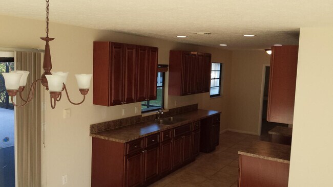 Building Photo - 3/2/1 with screened in patio/pool