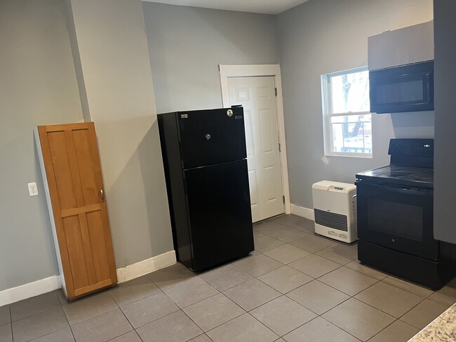 Back entrance to apartment comes into the kitchen - 94 Woodford St