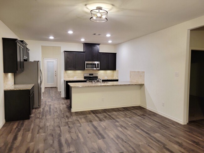 Open dining and kitchen island area - 2165 Miramar Dr