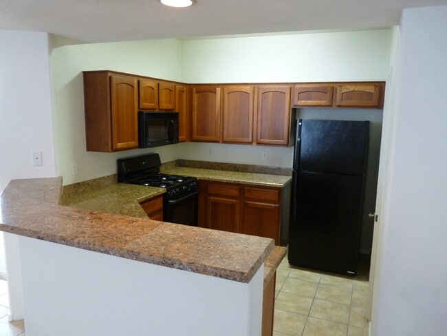 Building Photo - GATED 2 BEDROOM, 2 BATH CONDO IN JASMINE RANCH COMMUNITY