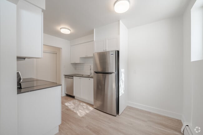 2BR, 1BA - 842SF - Kitchen & Dining Room - Woodford Apartments