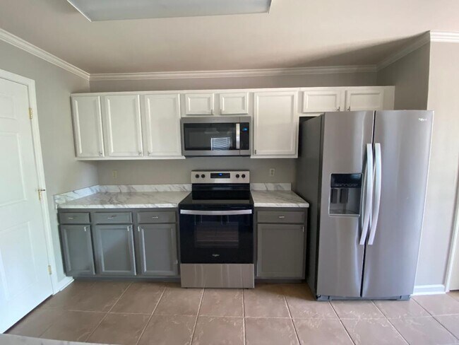 Cocina completamente remodelada - Guidry Row Apartment Homes