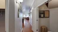 Located at 10800 McCombs St in El Paso, TX, this thoughtfully designed single-story home offers comfortable living across a well-utilized floor plan with one bedroom, two bathrooms, two closets, and a dedicated hallway. Rich terracotta-style tile flooring flows throughout the main living areas, complemented by crown molding that adds a refined architectural touch.

The kitchen is a standout feature, boasting dark espresso cabinetry, granite countertops, a classic subway tile backsplash, and a full suite of stainless steel appliances. A breakfast bar with pendant lighting provides additional seating and connects seamlessly to the dining and living areas, creating an open, social atmosphere.

The living room is bright and inviting, with multiple windows fitted with white blinds allowing natural light to fill the space. A ceiling fan adds comfort, while a sliding door provides access to the exterior.

The primary bedroom features plush carpeting, a window with natural light, and direct access to a private en-suite bathroom with granite vanity and dark wood cabinetry. A second full bathroom mirrors the same refined finishes. Both bathrooms include generous storage, with one featuring a built-in linen closet. The hallway entry is warmly lit and leads effortlessly through the home's cohesive, neutral-toned interior.