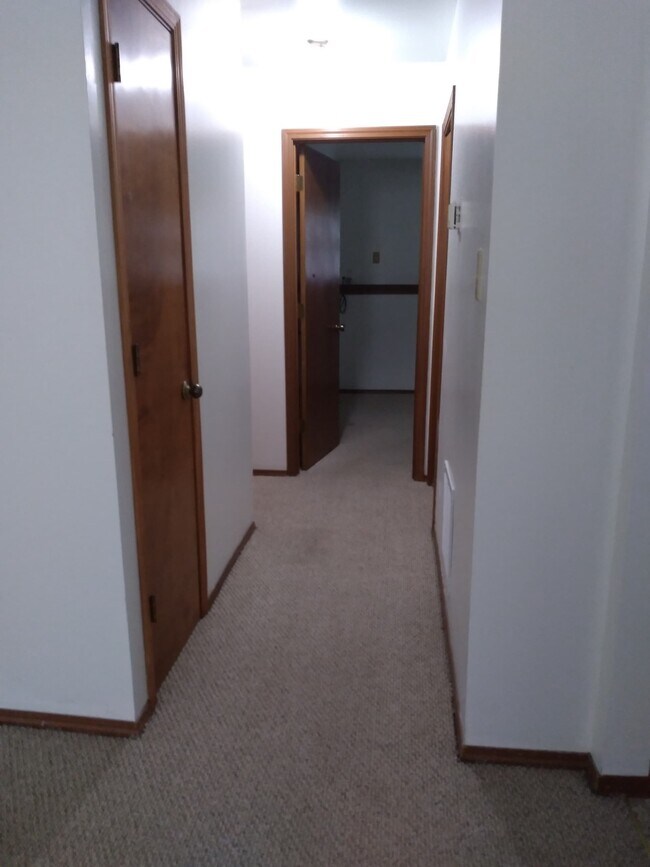 Hallway to bedroom with storage closet on left - 626 N Elmer St