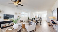Located in Colorado Springs, CO, this contemporary two-story home offers a thoughtfully designed layout across two well-proportioned floors. The main level opens into a bright, airy living space with light hardwood-style flooring, a ceiling fan, and large windows that invite generous natural light. The open-concept design seamlessly connects the living room, dining area, and kitchen, creating an ideal flow for daily living and entertaining. The kitchen is a standout feature, showcasing white cabinetry, subway tile backsplash, stainless steel appliances, and a marble-topped island with bar seating illuminated by pendant lighting. A powder room on the main floor adds convenience for guests, featuring a classic pedestal sink and clean, minimalist finishes. Upstairs, three bedrooms provide comfortable retreats, each equipped with ceiling fans and plush carpeting. The primary bedroom offers a well-sized layout with closet access. The additional bathrooms are finished with marble-look countertops and tasteful tilework. Three closets throughout the home ensure ample storage. With its crisp white walls, cohesive design palette, and abundance of natural light, this home delivers a modern, welcoming ambiance throughout.